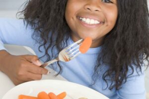 Kid eating healthy food